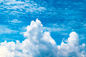huge White fluffy cloud against  blue sky summer abstract weather background.