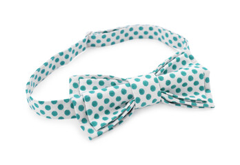 Stylish bow tie with green polka dot pattern on white background