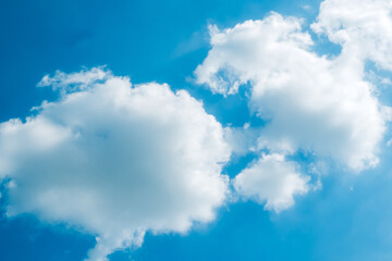 Obraz na płótnie Canvas Cotton-Clouded Sky: Blue Sky with Fluffy Clouds