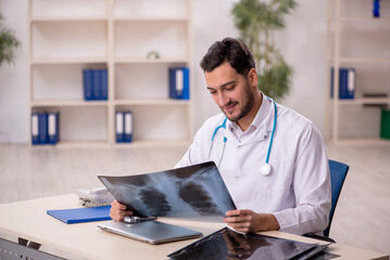 Young male doctor radiologist working in the clinic