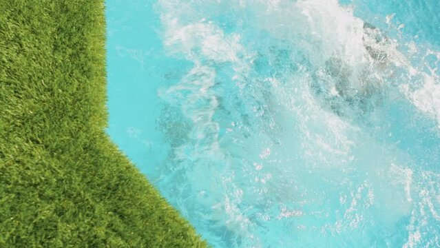 Fun Mother And Son Jumping In Swimming Pool At Home Celebrating  Enjoying Together On Summer Vacation 