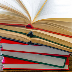 stack of books for learning on a wooden background