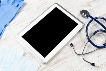 Mock up of doctors desktop with medical supplies