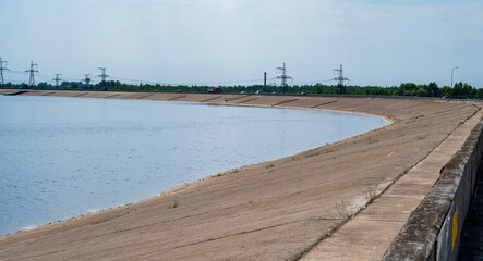 Grey concrete bank of the dam