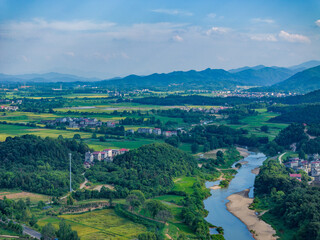 Fototapeta na wymiar Overlook of Chinese rural houses and river scenery,Aerial photography of pastoral scenery in Jiangxi, China