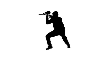 A silhouette of a paintball player running with a paintball gun in hand