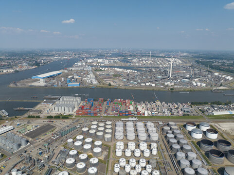 Rotterdam, 9th of June, 2023, The Netherlands. 3e Petroleumhaven in the Port of Rotterdam and the Oude Maas river. Industrial infrastructure. Container logistics and Shell pernis petrochemical complex
