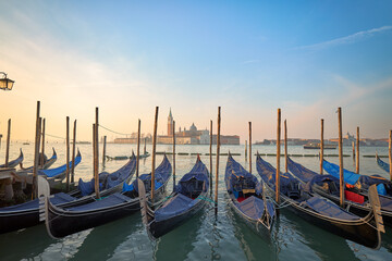 Sunrise in the Floating City: Gondolas Waiting in the Venetian Lagoon