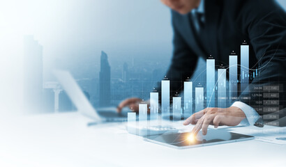 Businessman using tablet analyzing business growth graph data and progress, compass of navigate...