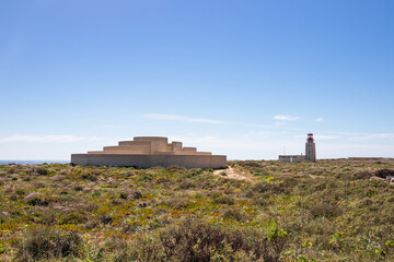 Fototapeta na wymiar A Voz do Mar (A Sound of the Sea) installation and Farol de Sagres (Lighthouse of Ponta de Sagres) located in Algarve, Portugal