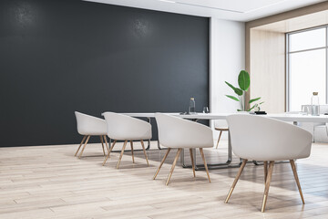 Perspective view of modern empty conference room with white office desk and chairs, black wall, wooden floor, and houseplant. 3D Rendering
