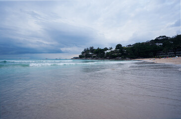Stormy weather on an ocean bech. Beautiful seascape with a cloudy sky.