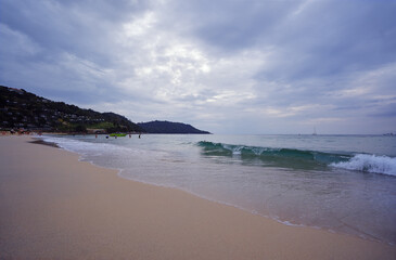 Stormy weather on an ocean bech. Beautiful seascape with a cloudy sky.