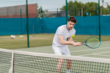 handsome man playing tennis on court, summer hobby and sport, motivation, sportsman
