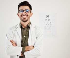 Eye exam, arms crossed and portrait of man optometrist with smile, confidence and friendly service in consultation office. Ophthalmology, face and happy male eye expert proud of vision testing career © Malik/peopleimages.com