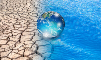 Water crisis and Climate change concept with earth planet on dry soil and water "Elements of this image furnished by NASA"