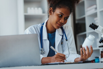 Science african american female researcher, drug testing, sometimes called pill testing or impurity...