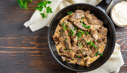 delicious beef stroganoff - veal strips stewed with porcini in sour cream sauce sprinkled with...