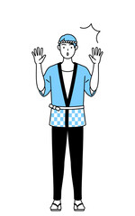 驚いて手を上げる夏祭りの法被を着た男性