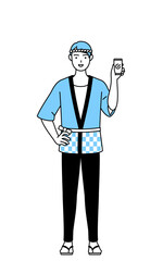 仕事でスマホを使う夏祭りの法被を着た男性