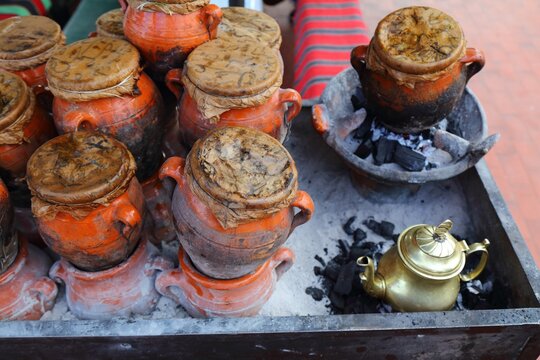 Tangia slow cooked stew. Moroccan food in a special terra cotta cooking pot in Marrakech market of Jemaa El-Fnaa.