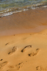 Closeup of sand and footprints on beach