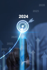 2024 Businessman analyzing company financial balance sheet working with digital virtual graphics...