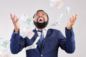 Money, rain and happy black man in studio for savings, growth or cashback bonus on white...