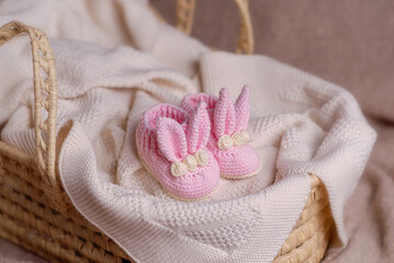 Cute wooden and knitted baby toys on light background. Eco accessories and teethers for newborns. 