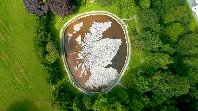 Aerial Drone slow vertical ascent over the Great Polish Map of Scotland at the village of Eddleston, Scottish Borders