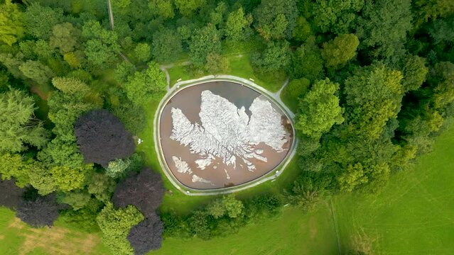 Aerial Drone rotating vertical ascent over the Great Polish Map of Scotland at the village of Eddleston, Scottish Borders.