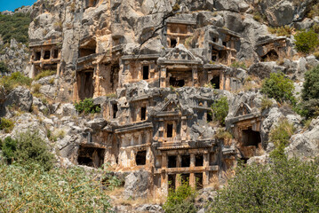 The ruins of the amphitheater and ancient rock tombs in the ancient city of Myra in Demre, Turkey