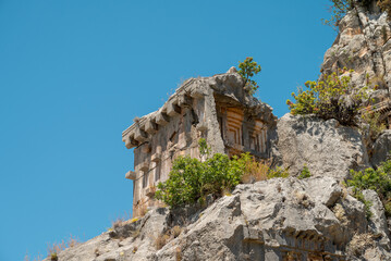 The ruins of the amphitheater and ancient rock tombs in the ancient city of Myra in Demre, Turkey