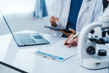Health care researchers working in life science laboratory, Teaching in labs - Requiring students...