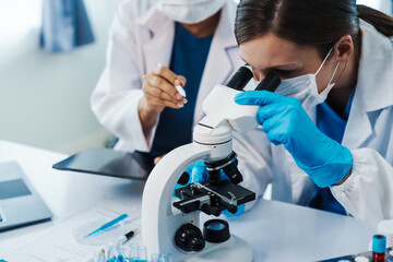 Health care researchers working in life science laboratory, Teaching in labs - Requiring students...