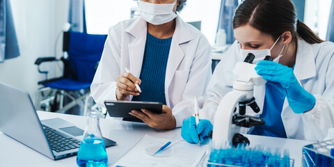 Health care researchers working in life science laboratory, Teaching in labs - Requiring students...