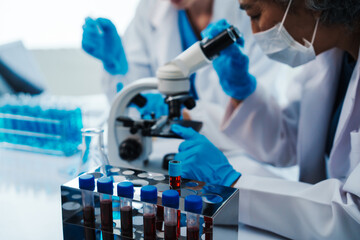 Health care researchers working in life science laboratory, Teaching in labs - Requiring students to record their laboratory methods and results as a running record of their laboratory work.