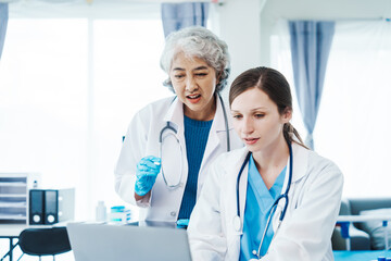 Health care researchers working in life science laboratory, Teaching in labs - Requiring students to record their laboratory methods and results as a running record of their laboratory work.