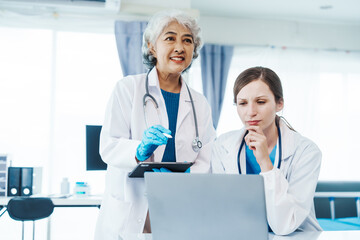 Health care researchers working in life science laboratory, Teaching in labs - Requiring students to record their laboratory methods and results as a running record of their laboratory work.