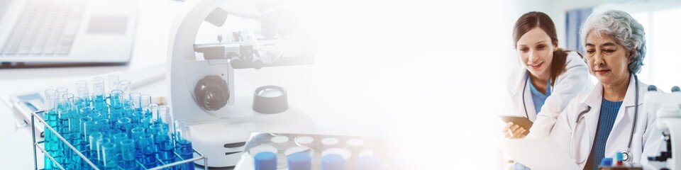 Health care researchers working in life science laboratory, Teaching in labs - Requiring students to record their laboratory methods and results as a running record of their laboratory work.