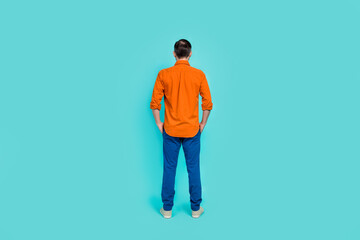 Full length size photo of formalwear businessman wear orange shirt with blue denim jeans hands pockets isolated on cyan color background