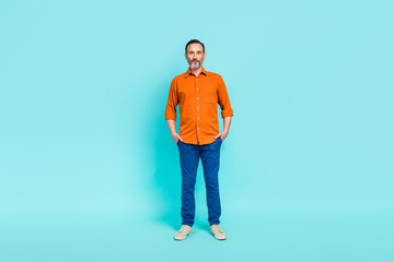 Full body size photo cadre of confident businessman put hands pockets entrepreneur ceo company chief boss isolated on blue color background