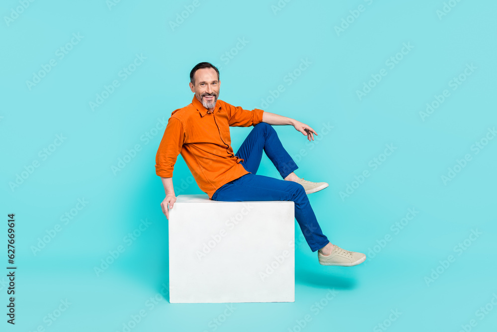 Sticker Full body photo cadre of optimistic retired business owner man sitting podium rest pause coworking zone isolated on blue color background