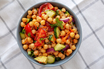 Homemade Avocado Chickpea Salad with Chili Lime Dressing in a Bowl, top view.