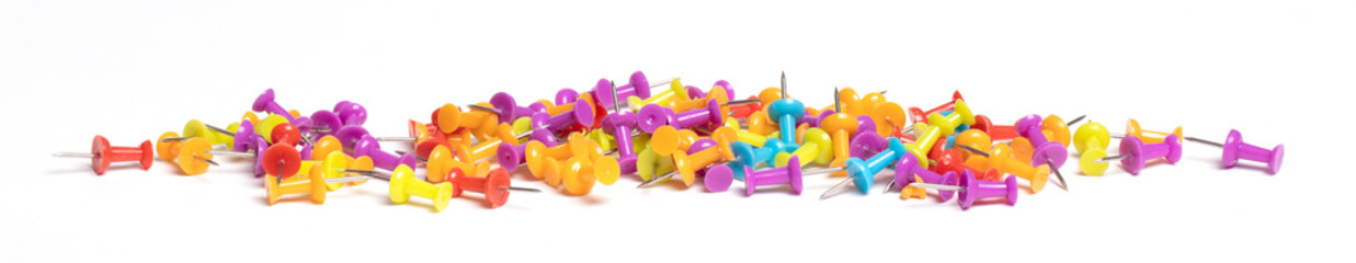 Many pushpins isolated on white
