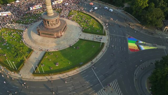 rainbow flag Smooth aerial top view flight 
CSD Pride Parade 2023 city Berlin Germany Summer evening Victory Column. drone shot from above
4K Cinematic footage.