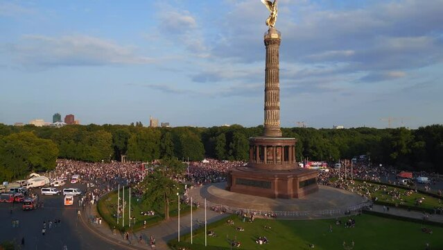 Love Parade trucks, Majestic aerial top view flight 
2023 city Berlin CSD PrideGermany Summer evening Victory Column. ascending drone
4K Cinematic footage.