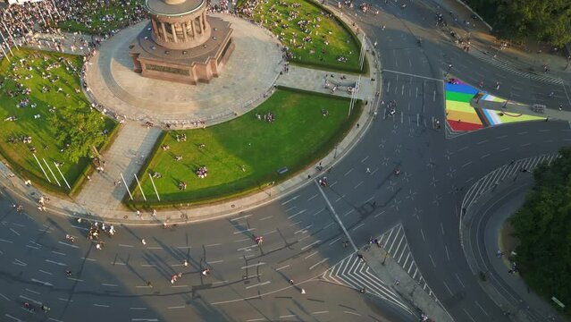 rainbow flag, Perfect aerial top view flight
CSD Pride Parade 2023 city Berlin Germany Summer evening Victory Column. tilt up drone
4K Cinematic footage.