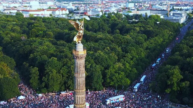 love Parade Berlin city, Lovely aerial top view flight 
CSD Pride Parade 2023 Germany Summer evening Victory Column. tilt up drone
4K Cinematic footage.