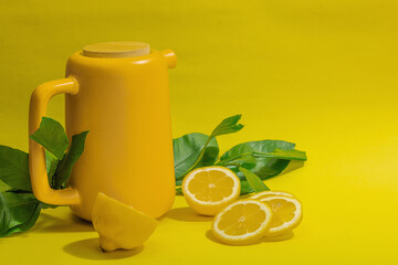 Lemon tea in ceramic tea pot with ripe fruits. Refreshment seasonal drink, conceptual background